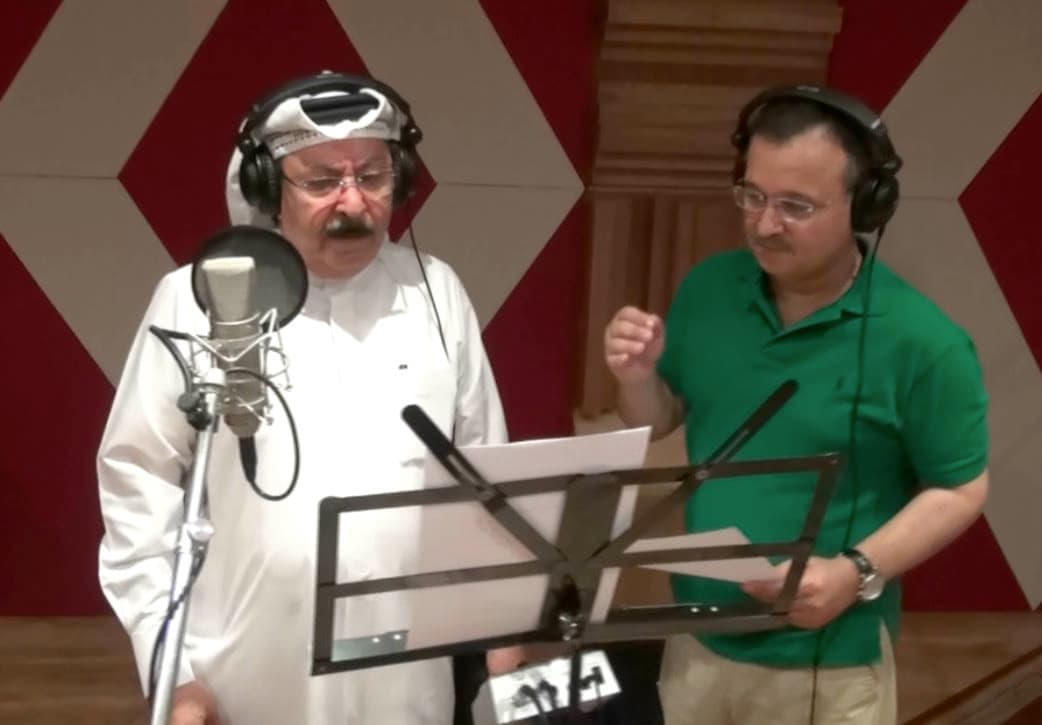 Waheed Alkhan directing the singer Ahmed Al Jumairi during a vocal recording
